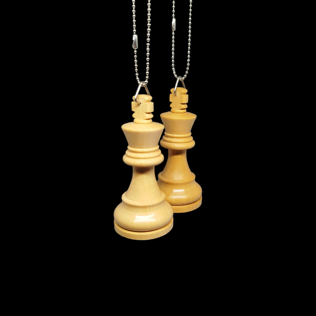Wooden chess pieces hanging