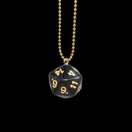 Black polyhedral die pendant with gold numbers on a gold chain