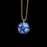 Blue polyhedral die pendant on a gold chain