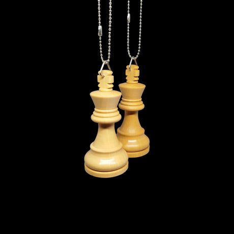 Wooden chess pieces hanging